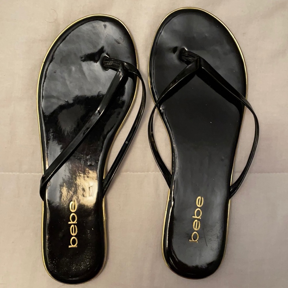 NWOT Bebe Black and Gild Flip Flops